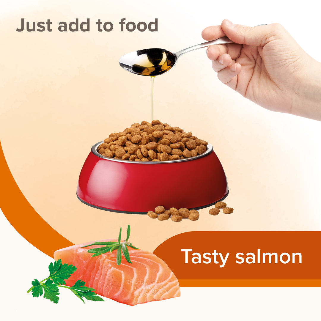 Beaphar Salmon Oil poured onto dry pet food, tasty salmon flavour