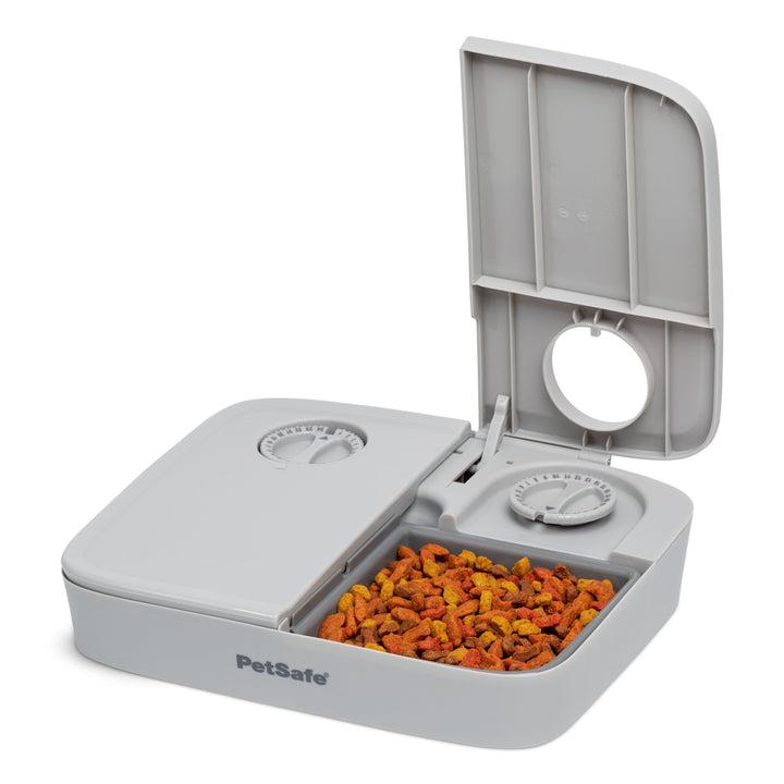 PetSafe Automatic 2 Meal Pet Feeder with lid open and dry food in the tray