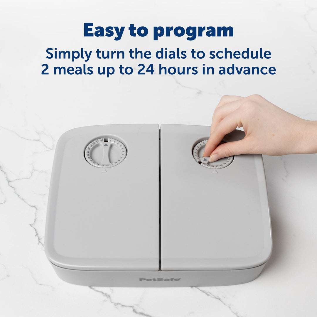 Turning the dial timer to schedule meals on the PetSafe 2 Meal Pet Feeder