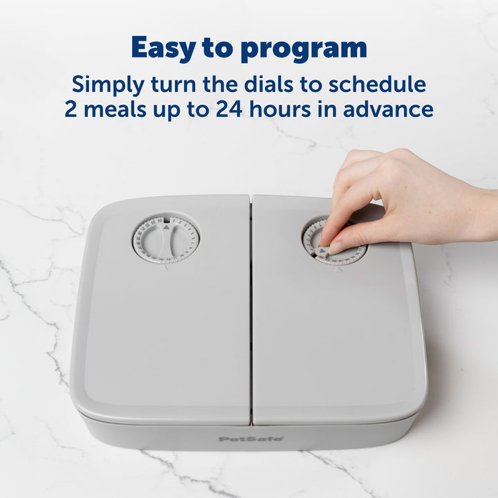 Turning the dial timer to schedule meals on the PetSafe 2 Meal Pet Feeder