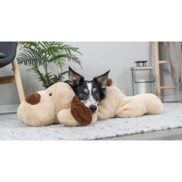 Dog resting its head on the Trixie Cuddle Dog Benny 75cm plush